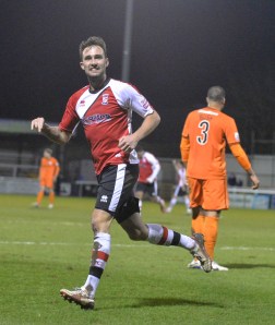 Payne celebrates his goal against Hereford United