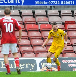 Jack Parkinson on the ball as Woking lose out to Wrexham last season