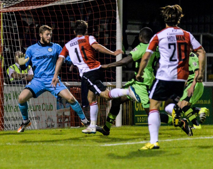 John Goddard heads Woking ahead against Forest Green Rovers 